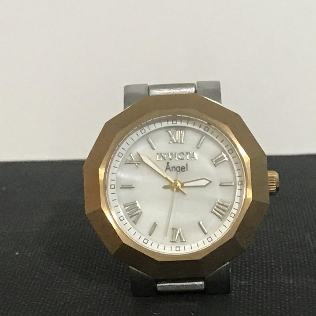Invicta Angel Women's Gold Mother of Pearl Dial Watch #: Invicta Angel Women's Gold Mother of Pearl Dial Watch # 0544 Working Please view all photos as they are part of the description and condition of this Item, Feel free to contact me with questions or pi