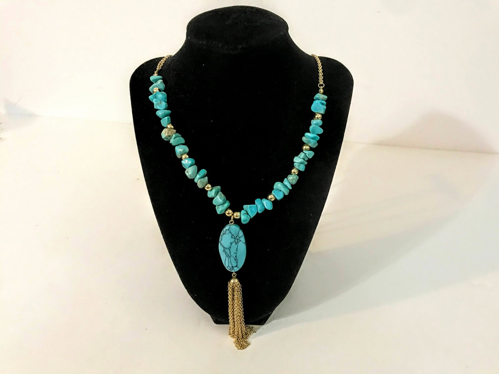 Gold Tone Finish Turquoise Stone Pendant Tassel Charm: Gold Tone Finish Turquoise Stone Pendant Tassel Charm Necklace 32" Please view all photos as they are part of the description and condition of this Item, Feel free to contact me with questions or pict