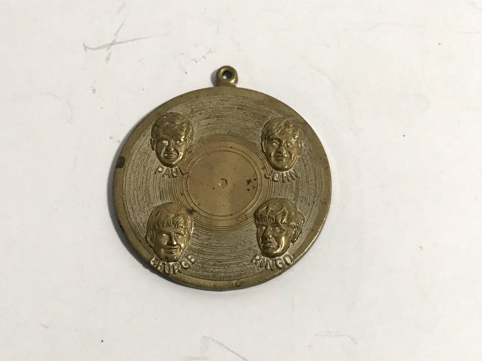 Rare Vintage Original 1964 The Beatles Brass pendant.: Rare Vintage Original 1964 The Beatles Brass pendant. Please view all photos as they are part of the description and condition of this Item, Feel free to contact me with questions or picture requests!