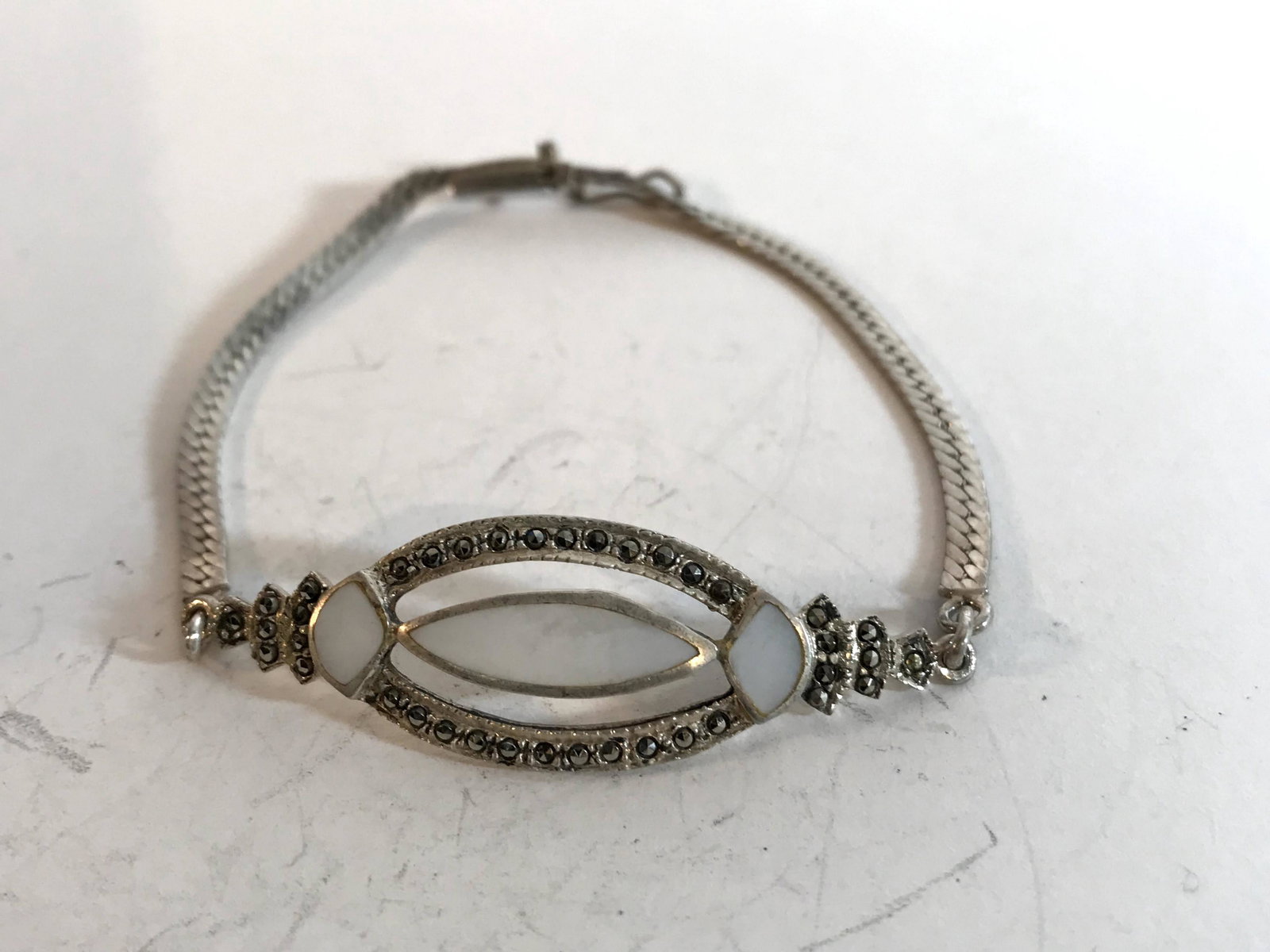 Vintage sterling Marcasite Mother of Pearl Bracelet: Vintage sterling Marcasite Mother of Pearl Bracelet Please view all photos as they are part of the description and condition of this Item, Feel free to contact me with questions or picture requests! U