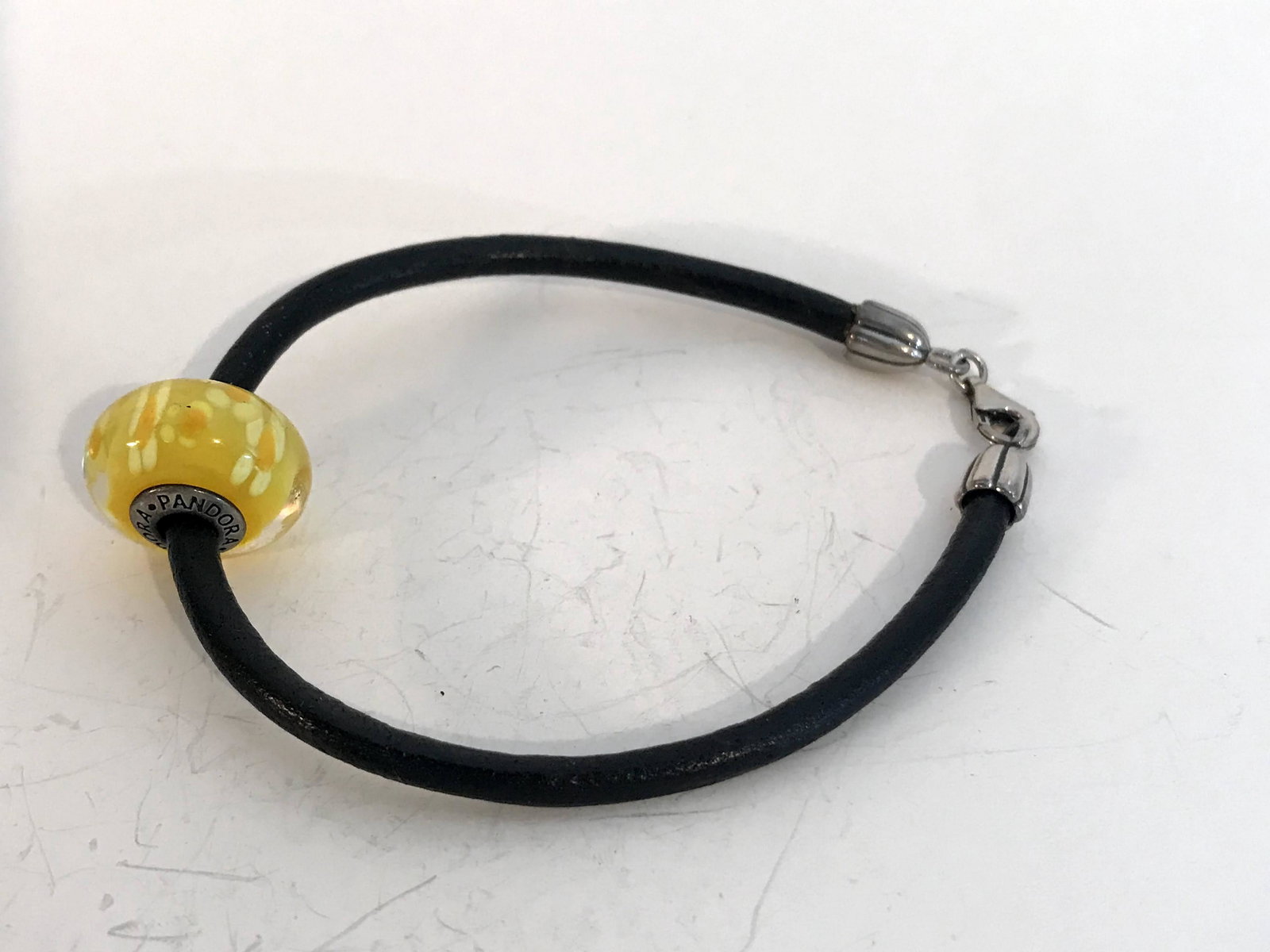 Pandora Sterling Silver Black Leather Bracelet UV Lemon: Pandora Sterling Silver Black Leather Bracelet UV Lemon Drop Daffodil 8.5" Please view all photos as they are part of the description and condition of this Item, Feel free to contact me with questions