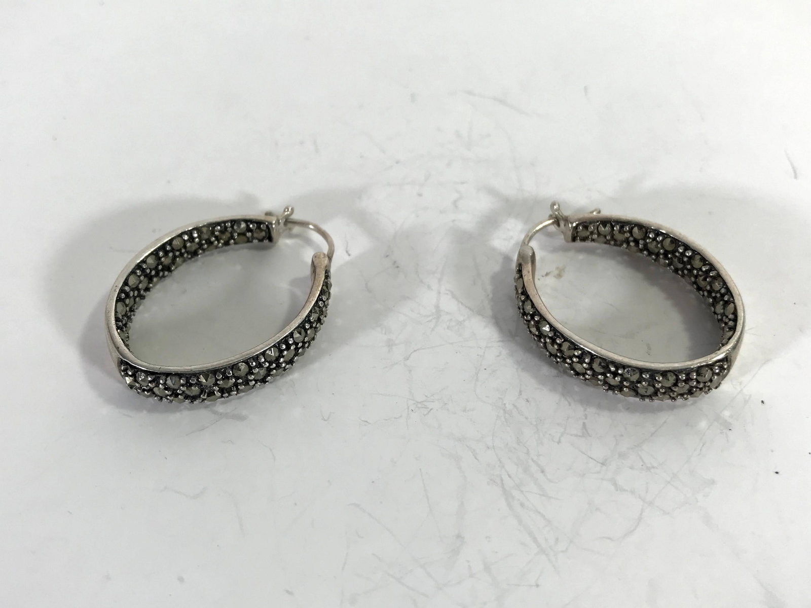 Vintage Marcasite Hoop Sterling Silver Earrings: Vintage Marcasite Hoop Sterling Silver EarringsPlease view all photos as they are part of the description and condition of this Item, Feel free to contact me with questions or picture requests! Used I