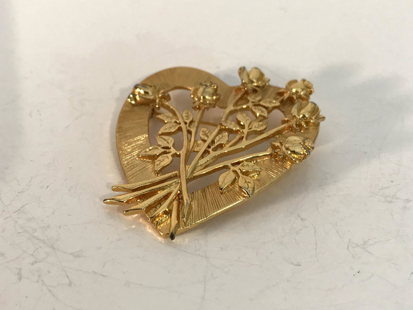 Vintage gold tone JJ heart Brooch: Vintage gold tone JJ heart Brooch Please view all photos as they are part of the description and condition of this Item, Feel free to contact me with questions or picture requests! Used Item AS IS