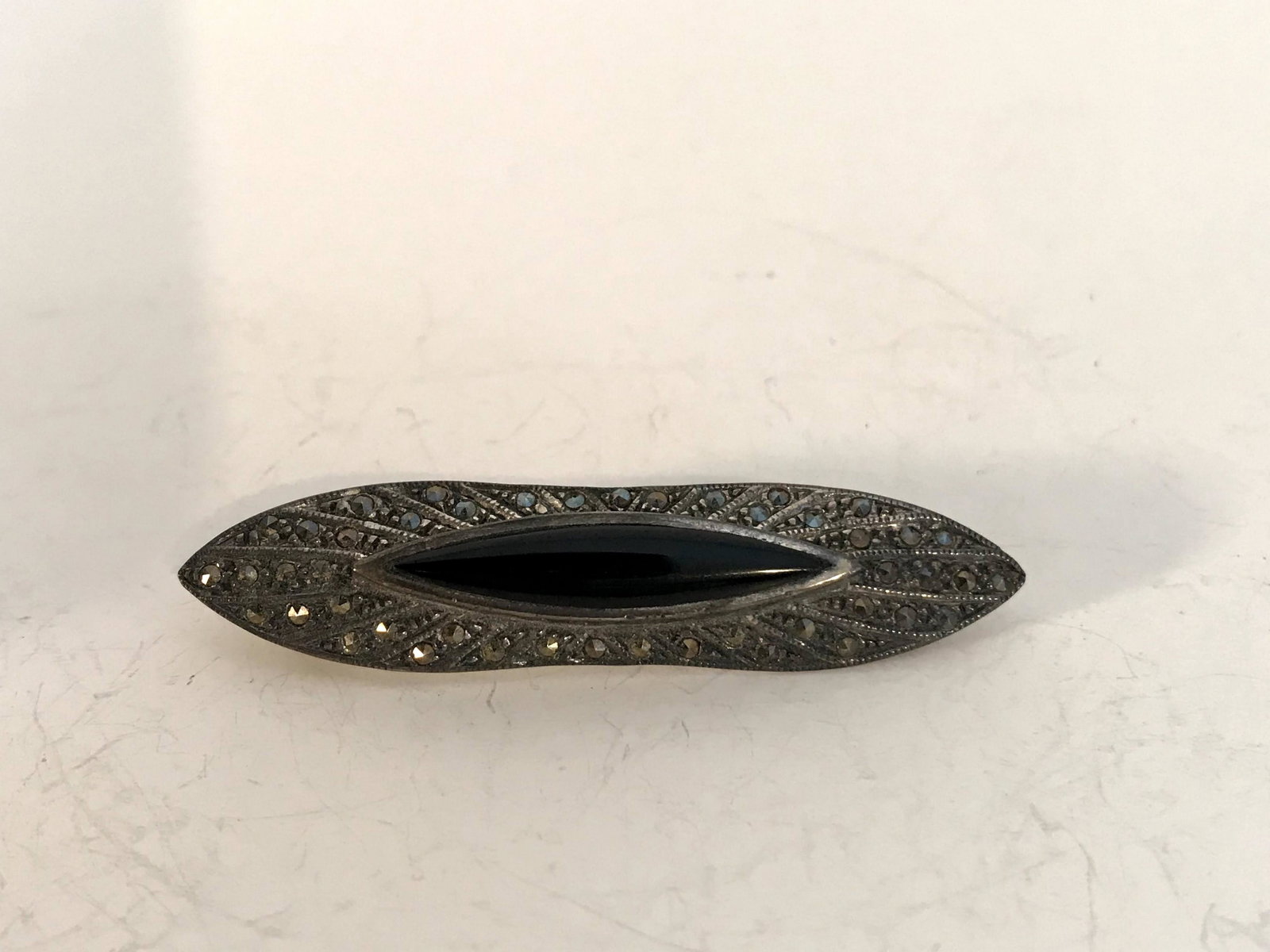 Vintage Sterling Onxz Marcasite Brooch: Vintage Sterling Onxz Marcasite Brooch Please view all photos as they are part of the description and condition of this Item, Feel free to contact me with questions or picture requests! Used Item AS I