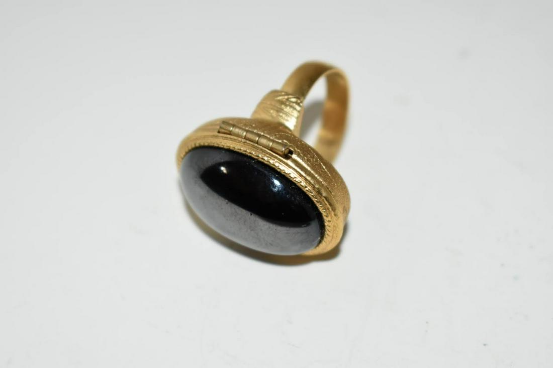 Vtg Avon Perfume Poison Adjustable Ring Hermitite Stone: Vtg Avon Perfume Poison Adjustable Ring Hermitite StonePlease view all photos as they are part of the description and condition of this Item, Feel free to contact me with questions or picture requests
