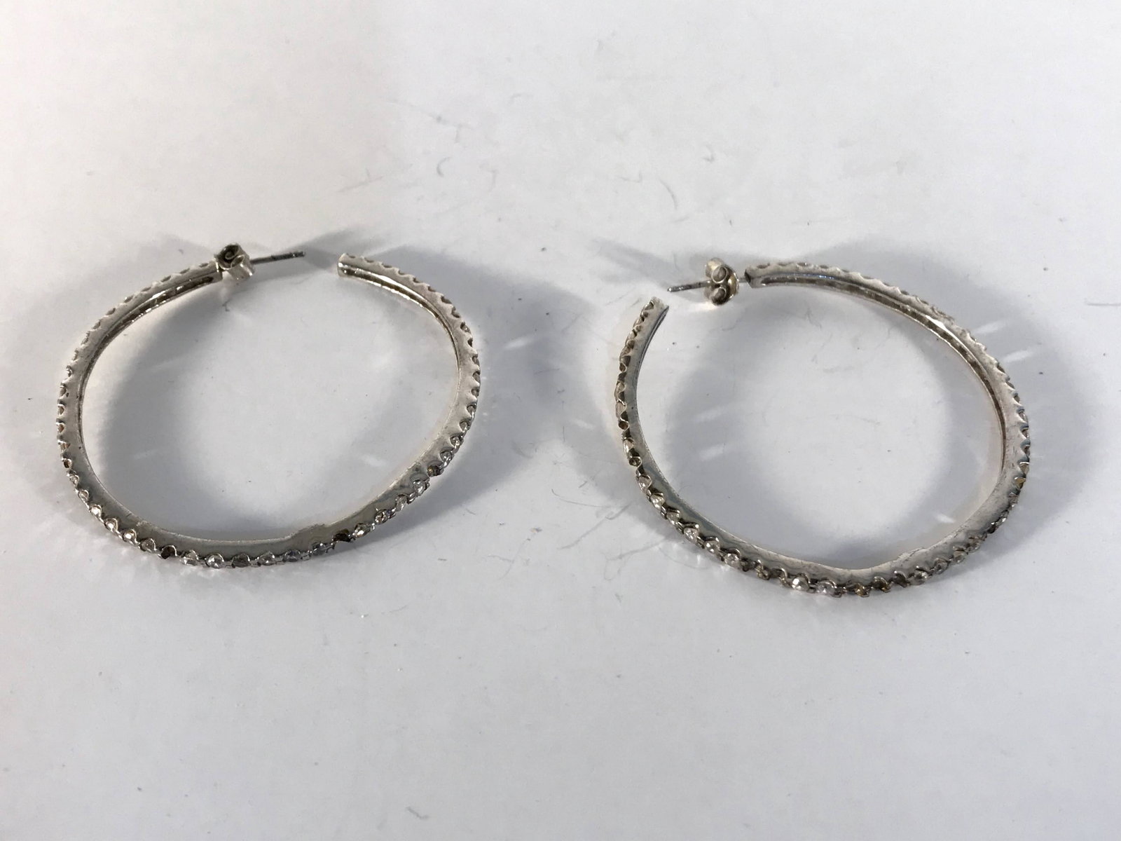 Vintage Sterling Silver Rhinestone Hoop Earrings 2": Vintage Sterling Silver Rhinestone Hoop Earrings 2" missing some stones Please view all photos as they are part of the description and condition of this Item, Feel free to contact me with questions or