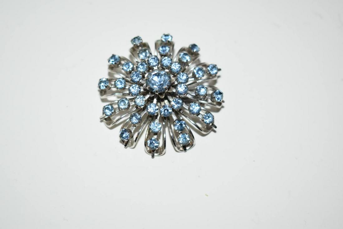 Vintage Rhinestone Coro blue flower Brooch: Vintage Rhinestone Coro blue flower BroochPlease view all photos as they are part of the description and condition of this Item, Feel free to contact me with questions or picture requests! Used Item A
