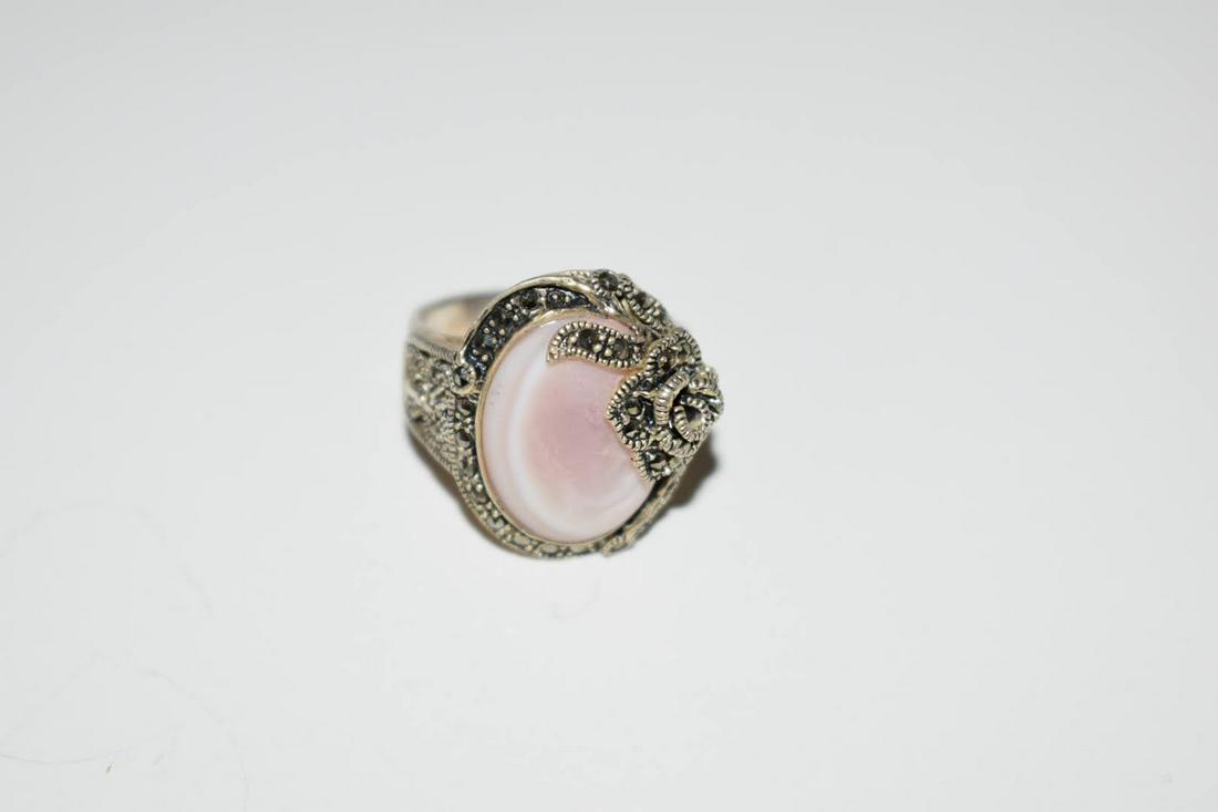 Nice Marcasite mother of pearl sterling flower ring 7.8: Nice Marcasite mother of pearl sterling flower ring 7.8Please view all photos as they are part of the description and condition of this Item, Feel free to contact me with questions or picture requests