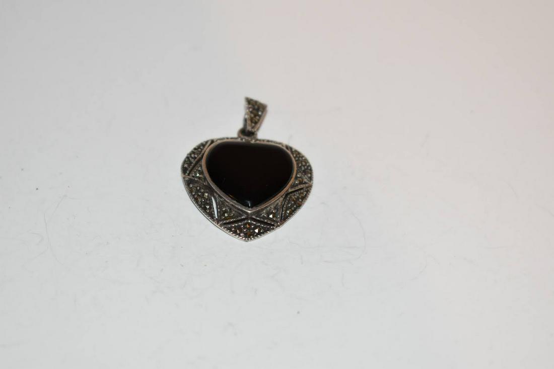Vintage Marcasite onyx Sterling Silver Pendant 1 3/4?: Vintage Marcasite onyx Sterling Silver Pendant 1 3/4” Please view all photos as they are part of the description and condition of this Item, Feel free to contact me with questions or picture req