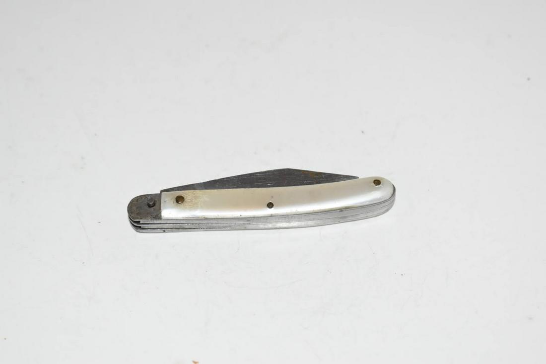 vintage sabre Mother of Pearl knife 678 missing a piece: vintage sabre Mother of Pearl knife 678 missing a piece Please view all photos as they are part of the description and condition of this Item, Feel free to contact me with questions or picture request