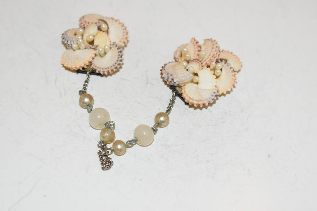 Vintage Shall sweater clip Brooch: Vintage Shall sweater clip Brooch Please view all photos as they are part of the description and condition of this Item, Feel free to contact me with questions or picture requests! Used Item AS IS
