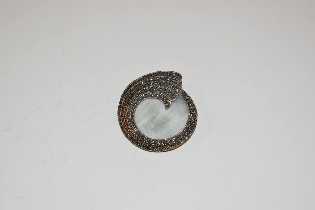 Vintage Marcasite Mother of pearl Sterling Brooch 1 3/4 in: Vintage Marcasite Mother of pearl Sterling Brooch 1 3/4 in Please view all photos as they are part of the description and condition of this Item, Feel free to contact me with questions or picture requ