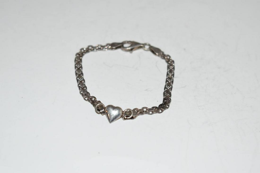Vintage Sterling Silver Heart Baby Bracelet 1 1/2": Vintage Sterling Silver Heart Baby Bracelet 1 1/2" Please view all photos as they are part of the description and condition of this Item, Feel free to contact me with questions or picture requests! Us