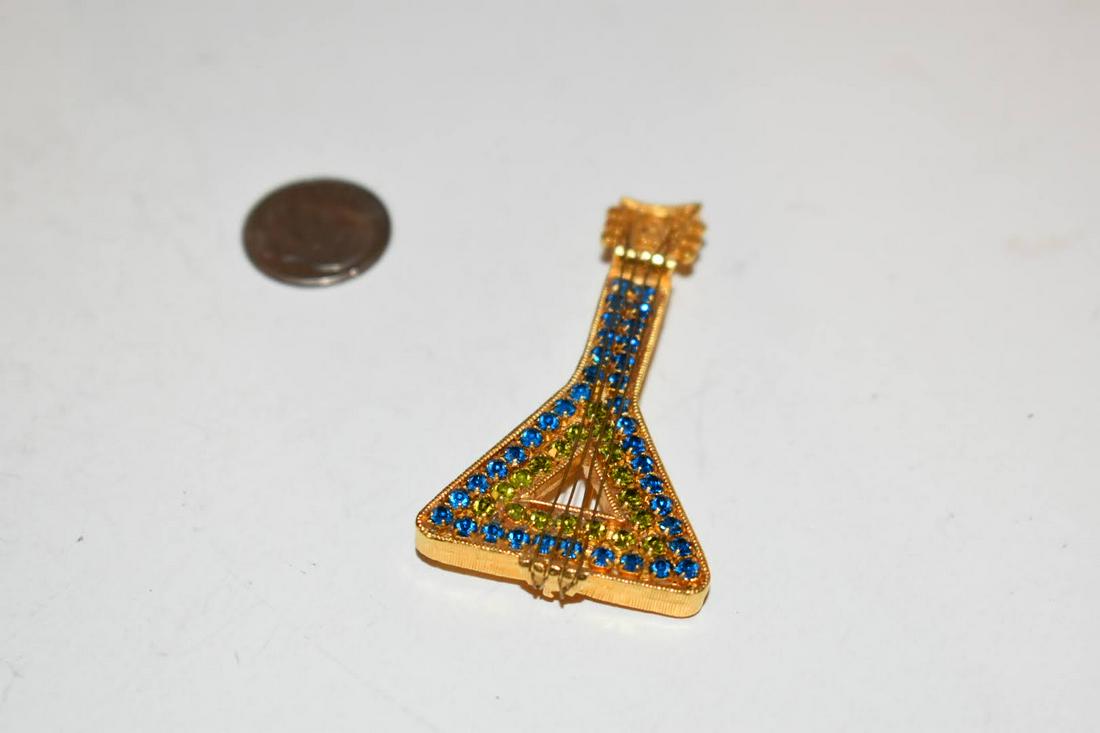 Vintage goldtone rhinestone instrument Brooch 2 inches: Vintage goldtone rhinestone instrument Brooch 2 inches Please view all photos as they are part of the description and condition of this Item, Feel free to contact me with questions or picture requests