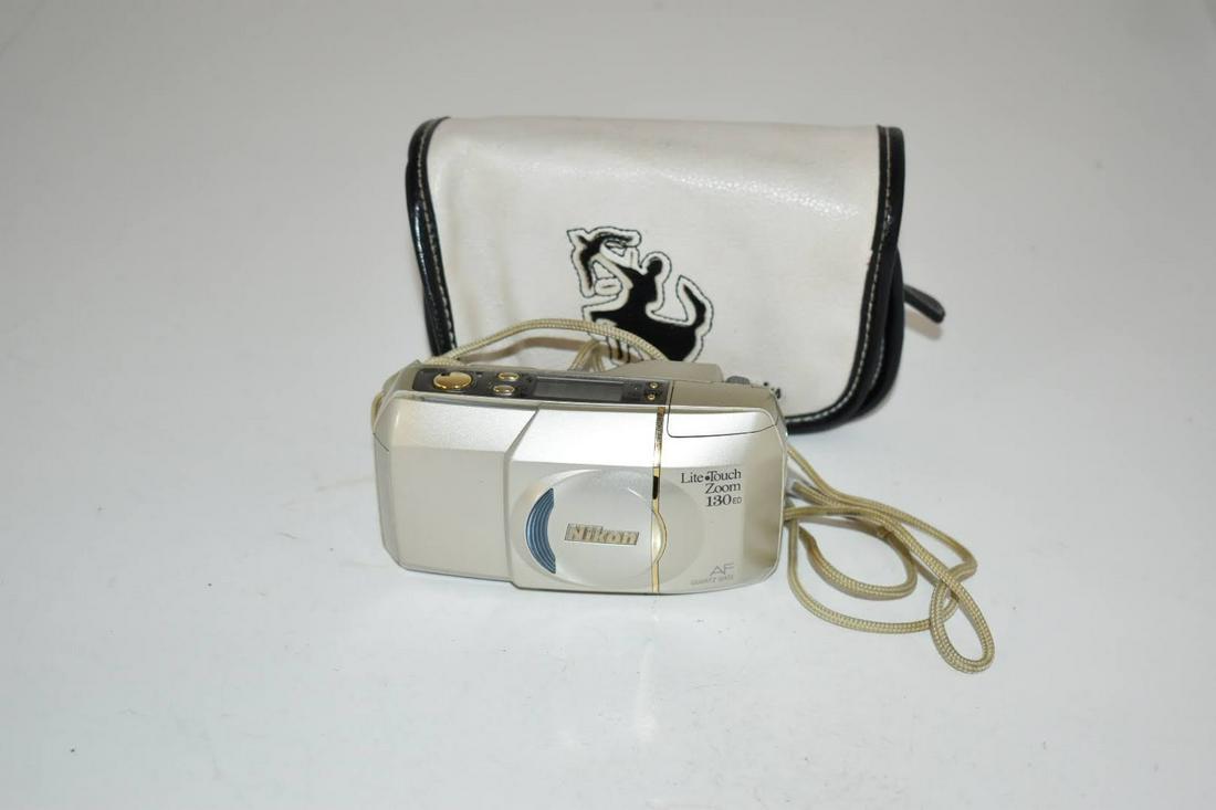 Nikon Lite Touch Zoom 130 ED AF 35mm Point & Shoot Film: Nikon Lite Touch Zoom 130 ED AF 35mm Point & Shoot Film Please view all photos as they are part of the description and condition of this Item, Feel free to contact me with questions or picture request
