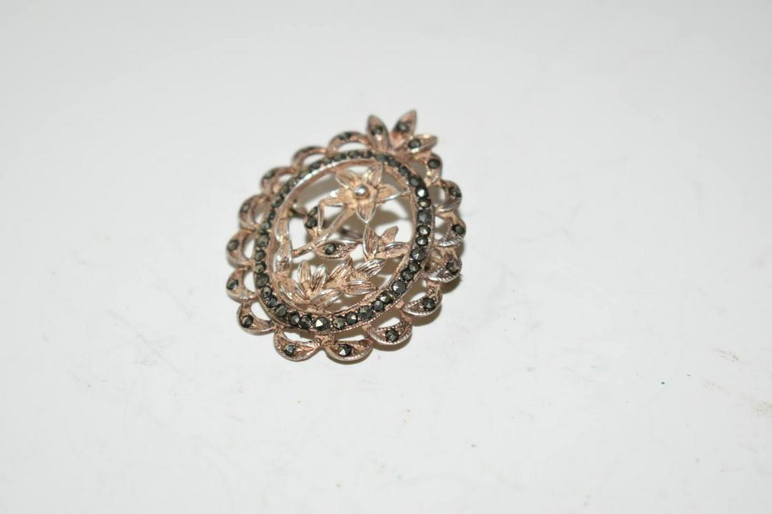 Vintage Marcasite Sterling Silver Flower Brooch: Vintage Marcasite Sterling Silver Flower BroochPlease view all photos as they are part of the description and condition of this Item, Feel free to contact me with questions or picture requests! Used I