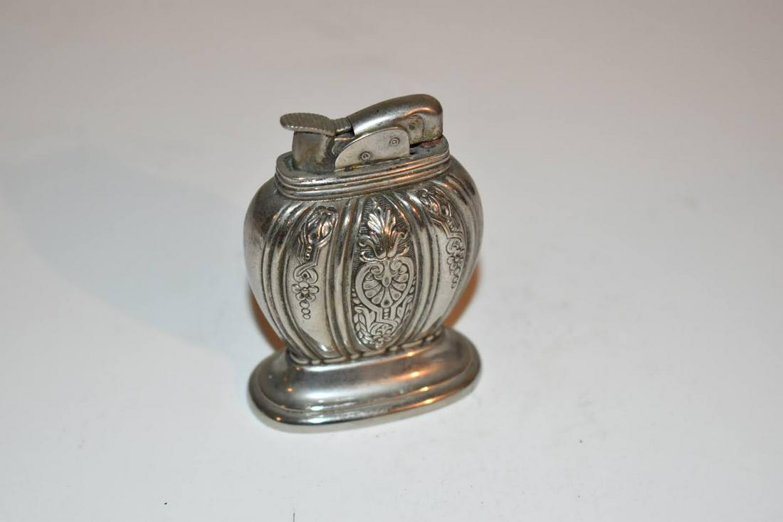 Vintage Evans table Lighter: Vintage Evans table Lighter Please view all photos as they are part of the description and condition of this Item, Feel free to contact me with questions or picture requests! Used Item AS IS