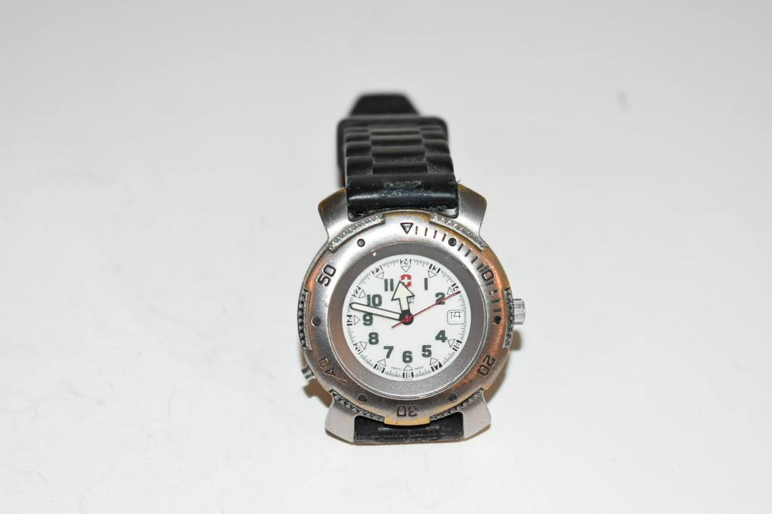 Vintage 1999 Swiss Army Man Lighted Watch Works Great!!!: Vintage 1999 Swiss Army Man Lighted Watch Works Great!!! Please view all photos as they are part of the description and condition of this Item, Feel free to contact me with questions or picture reques