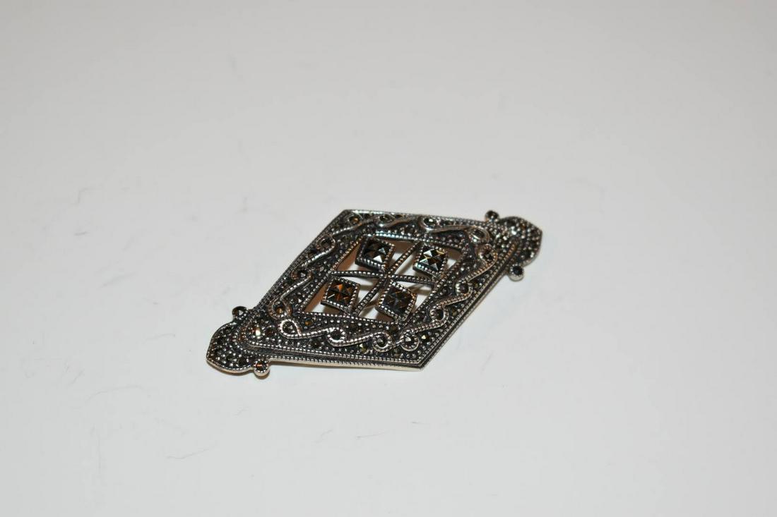 Vintage Marcasite Sterling Brooch 2 5/8 in: Vintage Marcasite Sterling Brooch 2 5/8 in Please view all photos as they are part of the description and condition of this Item, Feel free to contact me with questions or picture requests! Used Item 
