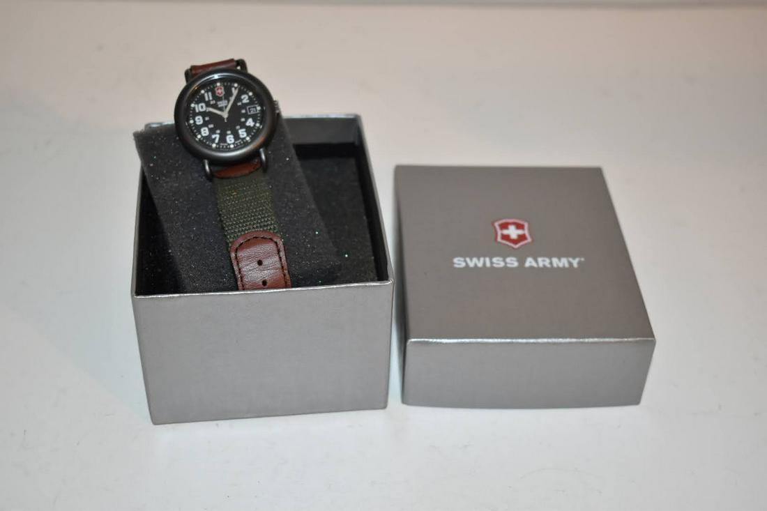 Vintage 1990s Swiss Army Quartz Wristwatch, Black Bezel New In Box: Vintage 1990s Swiss Army Quartz Wristwatch, Black Bezel New In Box Please view all photos as they are part of the description and condition of this Item, Feel free to contact me with questions or pict
