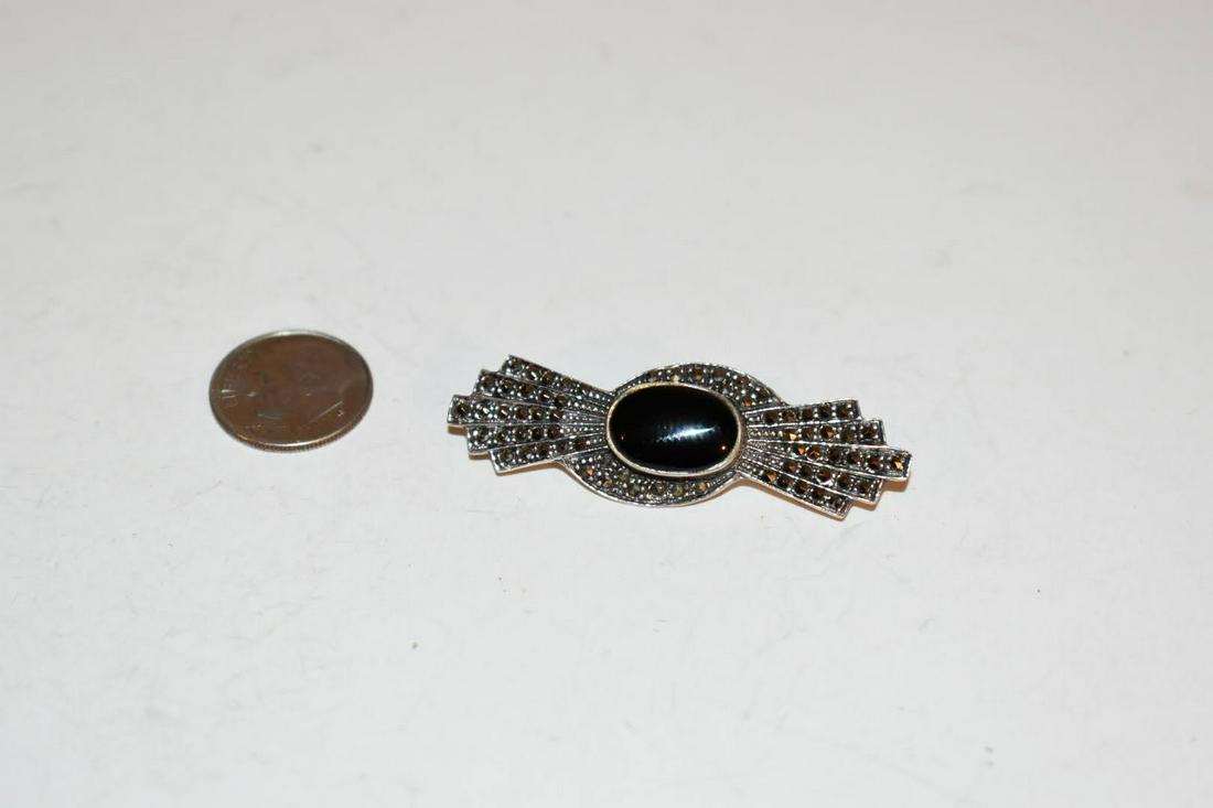 Vintage Sterling Silver Marcasite Onyx Brooch: Vintage Sterling Silver Marcasite Onyx Brooch Please view all photos as they are part of the description and condition of this Item, Feel free to contact me with questions or picture requests! Used It