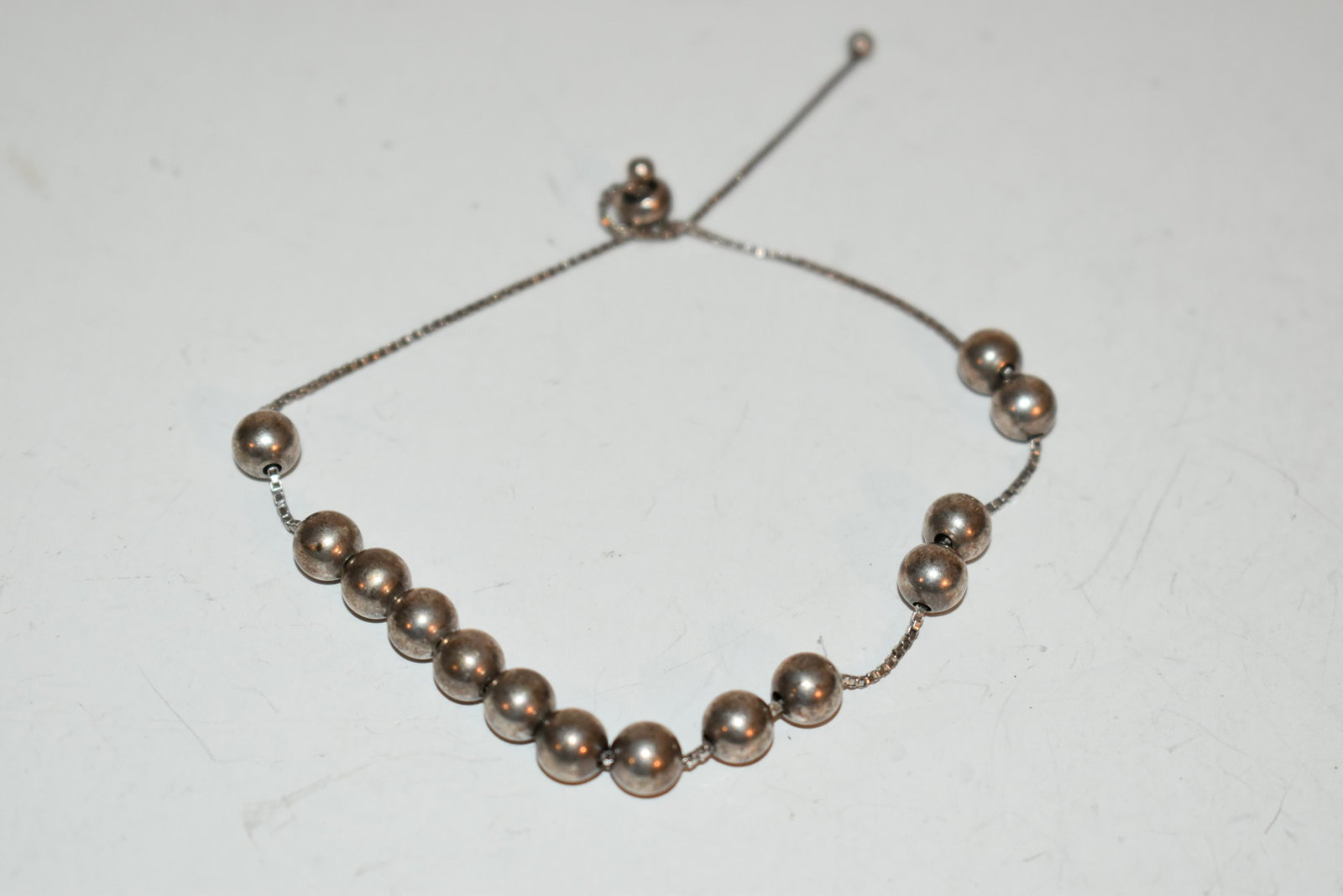 vintage sterling silver beaded adjustable bracelet: vintage sterling silver beaded adjustable bracelet Please view all photos as they are part of the description and condition of this Item, Feel free to contact me with questions or picture requests! Us