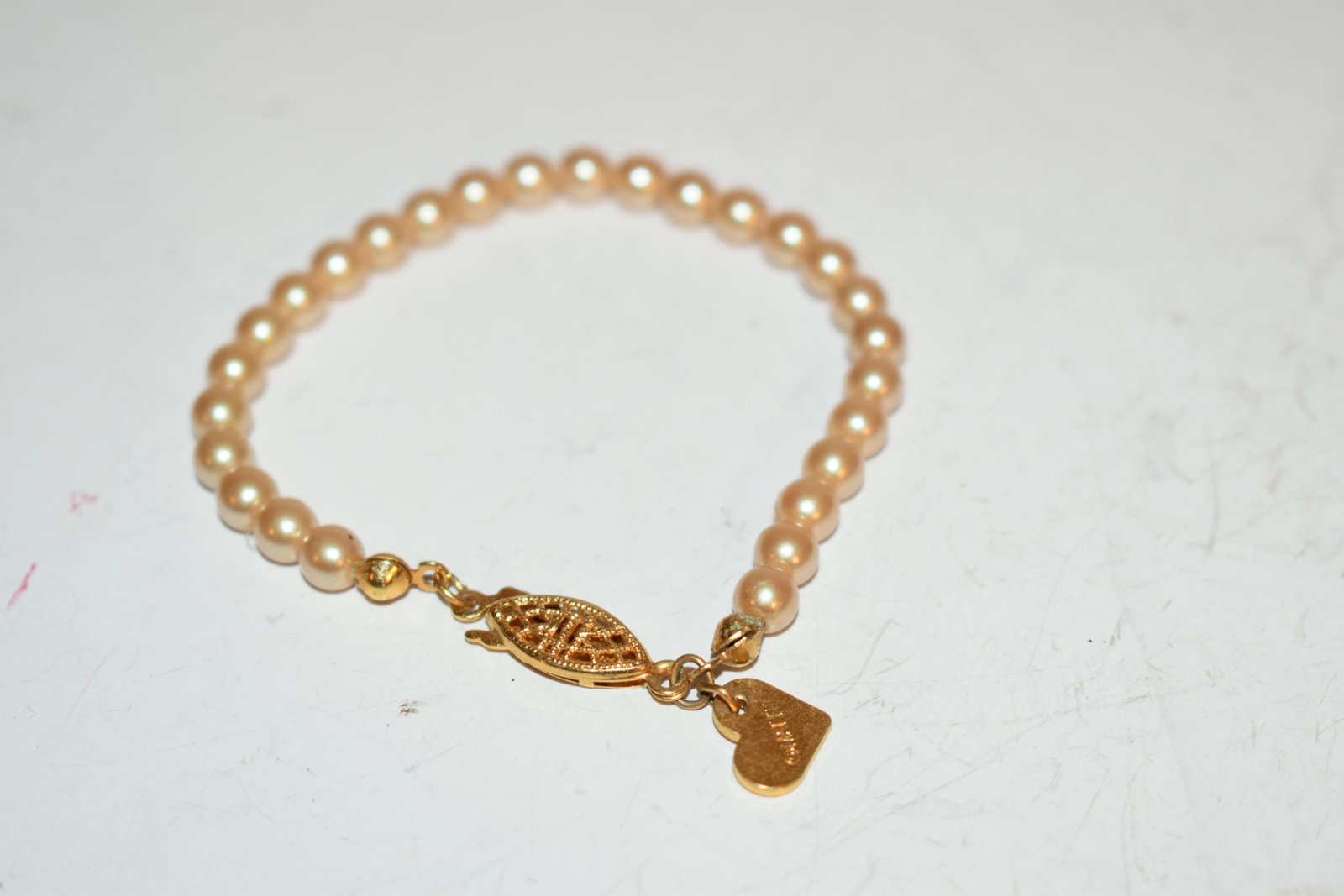 vintage pearl barbie heart bracelet 5": vintage pearl barbie heart bracelet 5" Please view all photos as they are part of the description and condition of this Item, Feel free to contact me with questions or picture requests! Used Item AS I