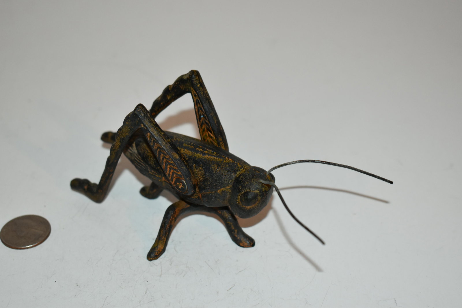 Vintage Cast Iron Grass Hopper 6": Vintage Cast Iron Grass Hopper 6" Please view all photos as they are part of the description and condition of this Item, Feel free to contact me with questions or picture requests! Used Item AS IS