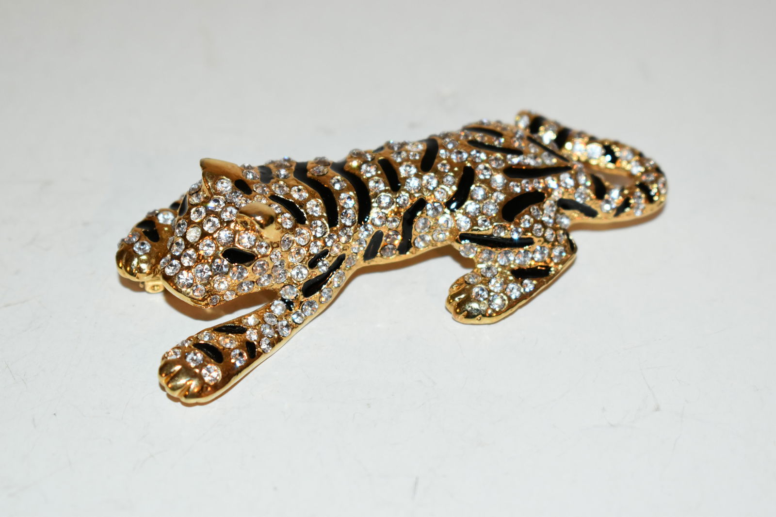 Vintage rhinestone tiger cat brooch 3 1/2": Vintage rhinestone tiger cat brooch 3 1/2" Please view all photos as they are part of the description and condition of this Item, Feel free to contact me with questions or picture requests! Used Item