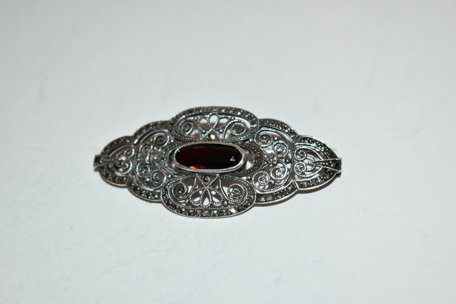 Vintage sterling silver Amethyst marcasite Brooch: Vintage sterling silver Amethyst marcasite Brooch Please view all photos as they are part of the description and condition of this Item, Feel free to contact me with questions or picture requests! Use