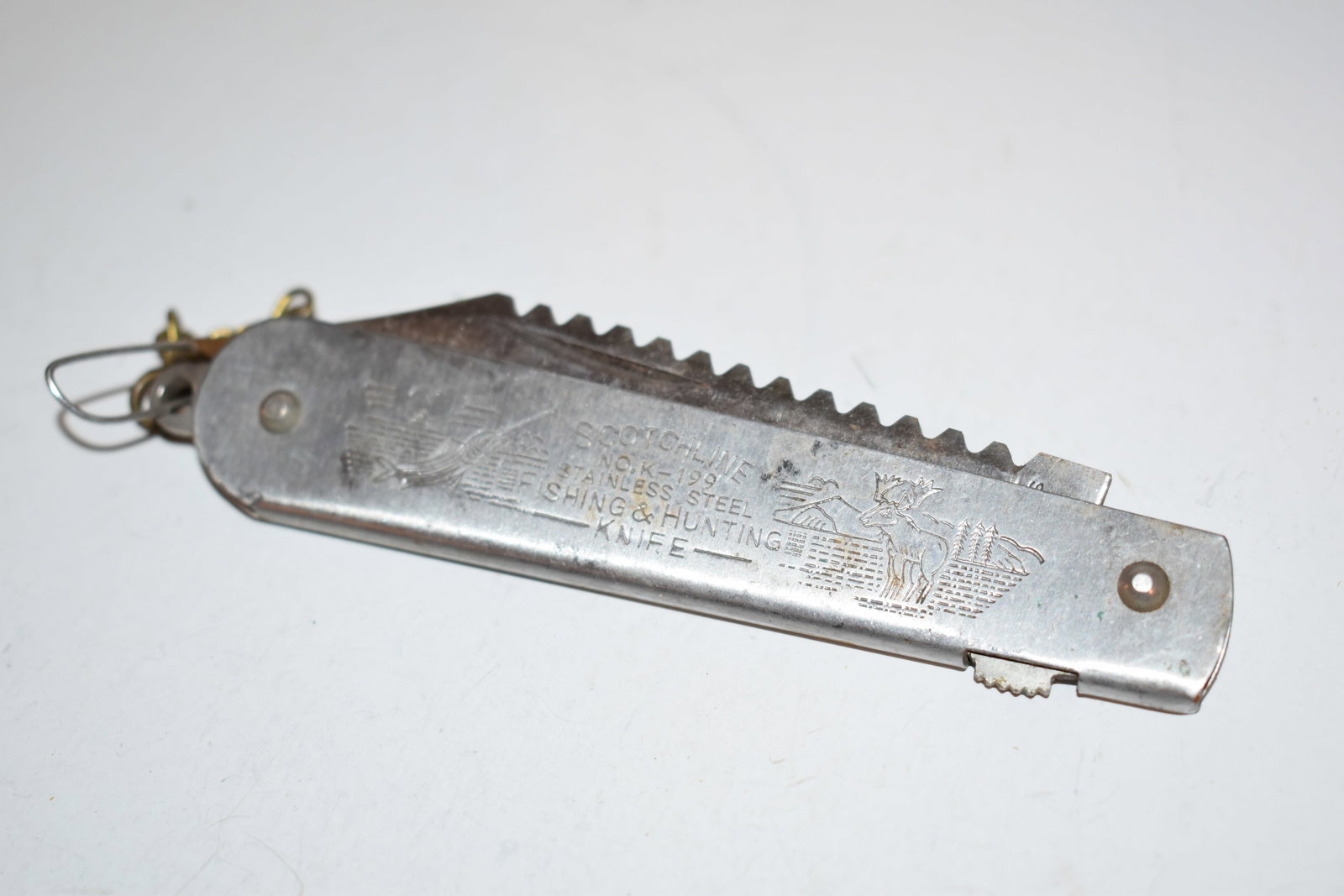 Scotchline K-199 Stainless Steel Hunting and Fishing Knife: Scotchline K-199 Stainless Steel Hunting and Fishing Knife Please view all photos as they are part of the description and condition of this Item, Feel free to contact me with questions or picture requ
