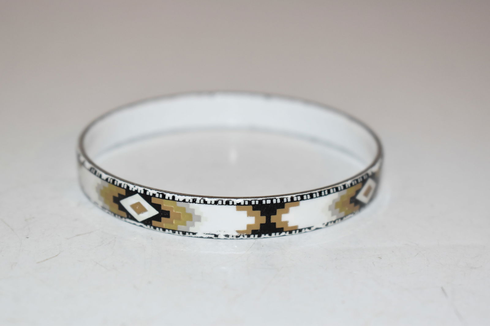Beautiful Vintage Michaela Frey Austrian white Enamel Bangle 7": Beautiful Vintage Michaela Frey Austrian white Enamel Bangle 7" Please view all photos as they are part of the description and condition of this Item, Feel free to contact me with questions or picture