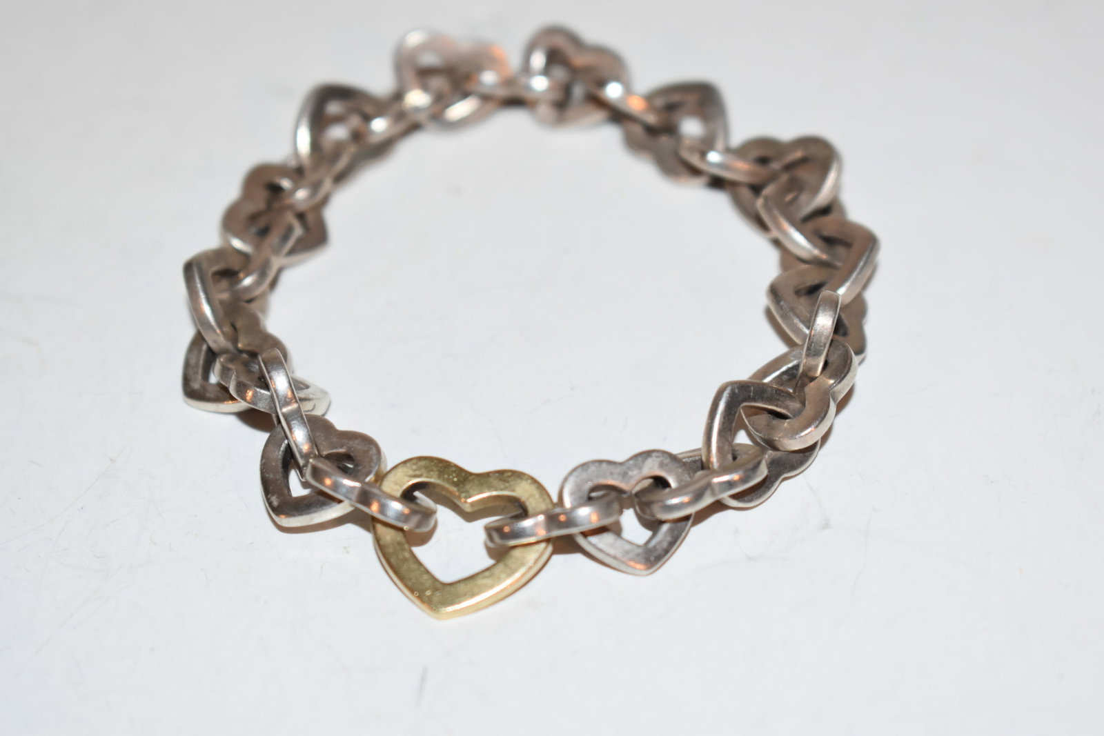 Tiffany & Co Sterling Silver 18 ct 18K Gold Solid Chain Heart Linking Bracelet: Tiffany & Co Sterling Silver 18 ct 18K Gold Solid Chain Heart Linking Bracelet Please view all photos as they are part of the description and condition of this Item, Feel free to contact me with quest