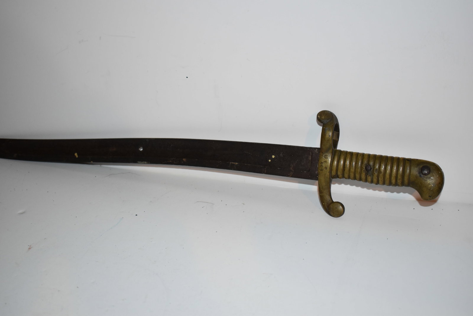Original Civil War Rifle Brass Sword Bayonet #70 0n & 699 with worn stamps there is a hole in the: Original Civil War Rifle Brass Sword Bayonet #70 0n & 699 with worn stamps there is a hole in the blade Please view all photos as they are part of the description and condition of this Item, Feel free