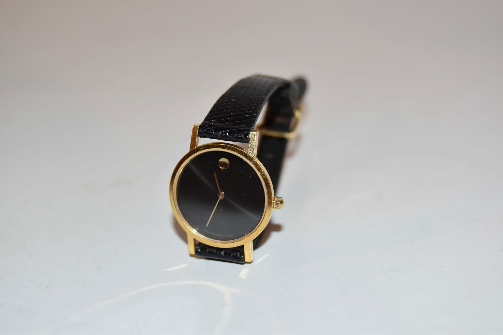 Vintage Slim Movado Quartz Watch works great!!!: Vintage Slim Movado Quartz Watch works great!!! Please view all photos as they are part of the description and condition of this Item, Feel free to contact me with questions or picture requests! Used