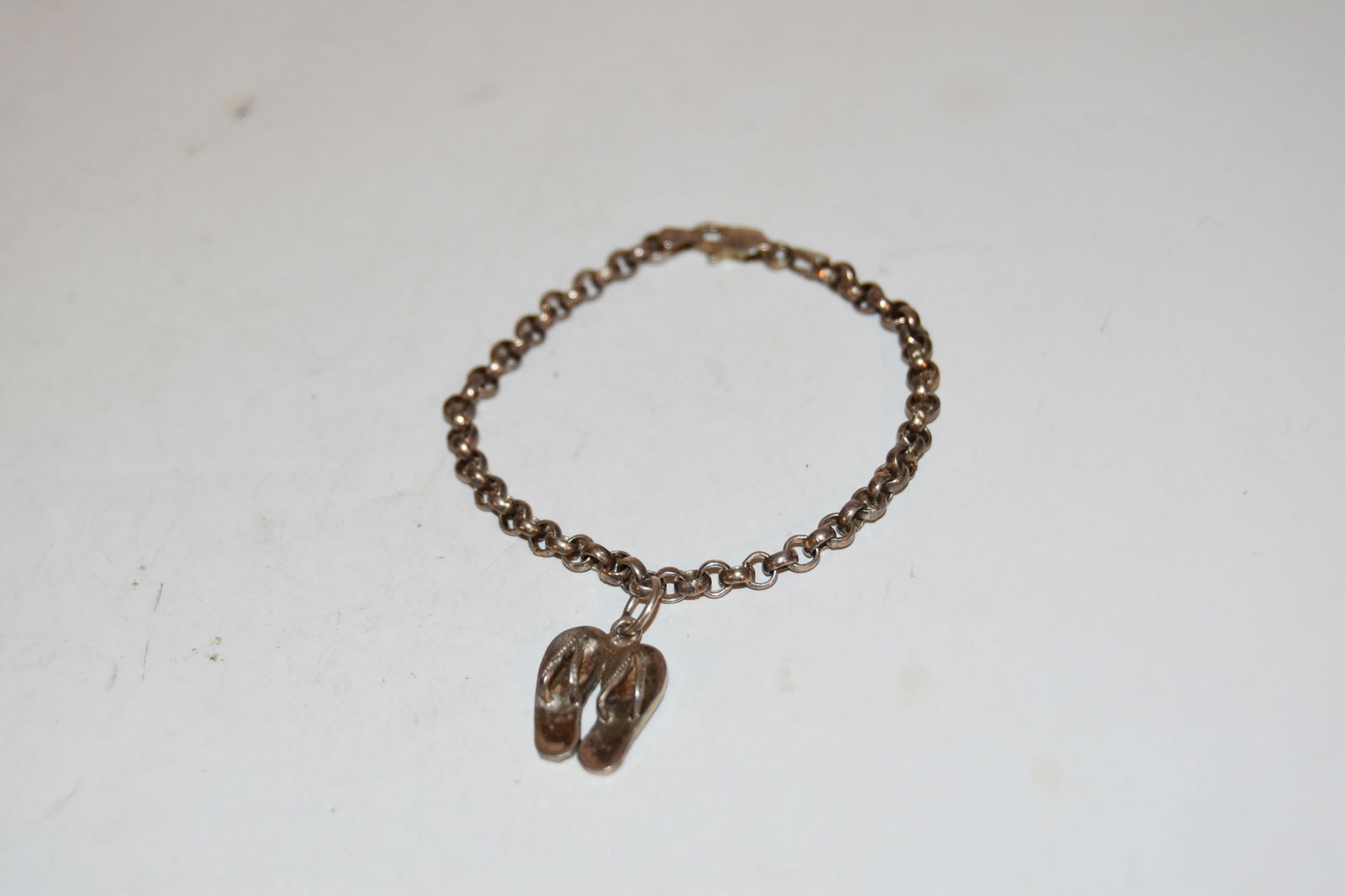 Vintage Sterling Silver Bracelet with sandals 6": Vintage Sterling Silver Bracelet with sandals 6" Please view all photos as they are part of the description and condition of this Item, Feel free to contact me with questions or picture requests! Used