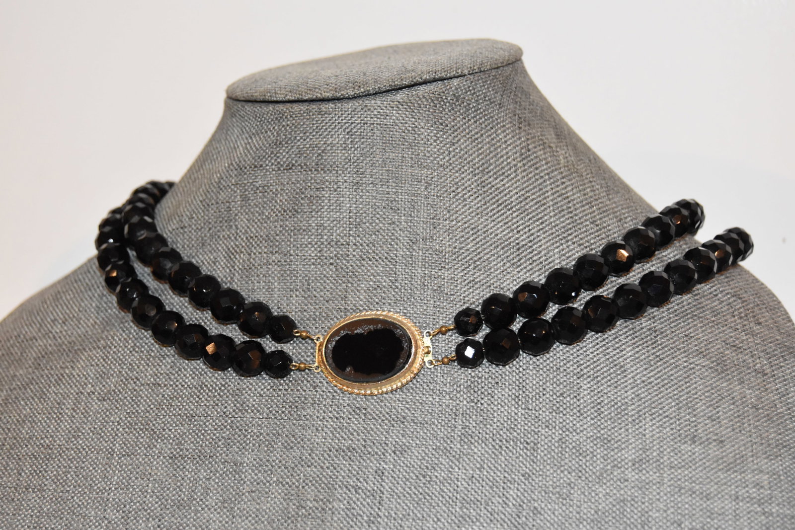 Vintage black glass cameo double beaded Necklace: Vintage black glass cameo double beaded Necklace Please view all photos as they are part of the description and condition of this Item, Feel free to contact me with questions or picture requests! Used
