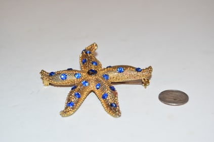 vintage goldtone blue rhinestone star fish Brooch