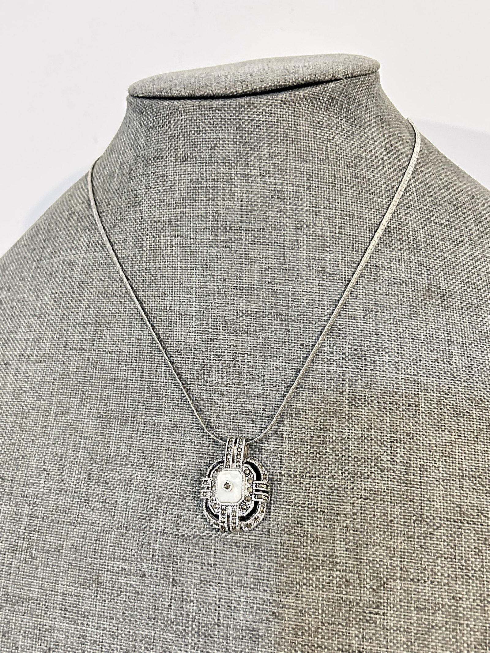 Vintage marcasite mother of pearl pendant Necklace: Vintage marcasite mother of pearl pendant Necklace Please view all photos as they are part of the description and condition of this Item, Feel free to contact me with questions or picture requests! Us