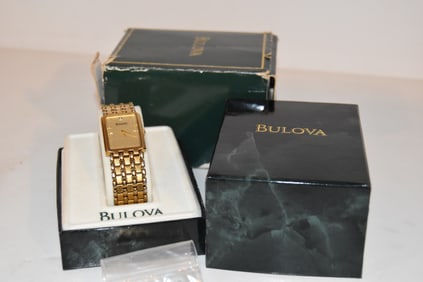 Vintage Bulova Mens Tank Rectangular Dress Gold Tone Quartz Watch works great very light scratches