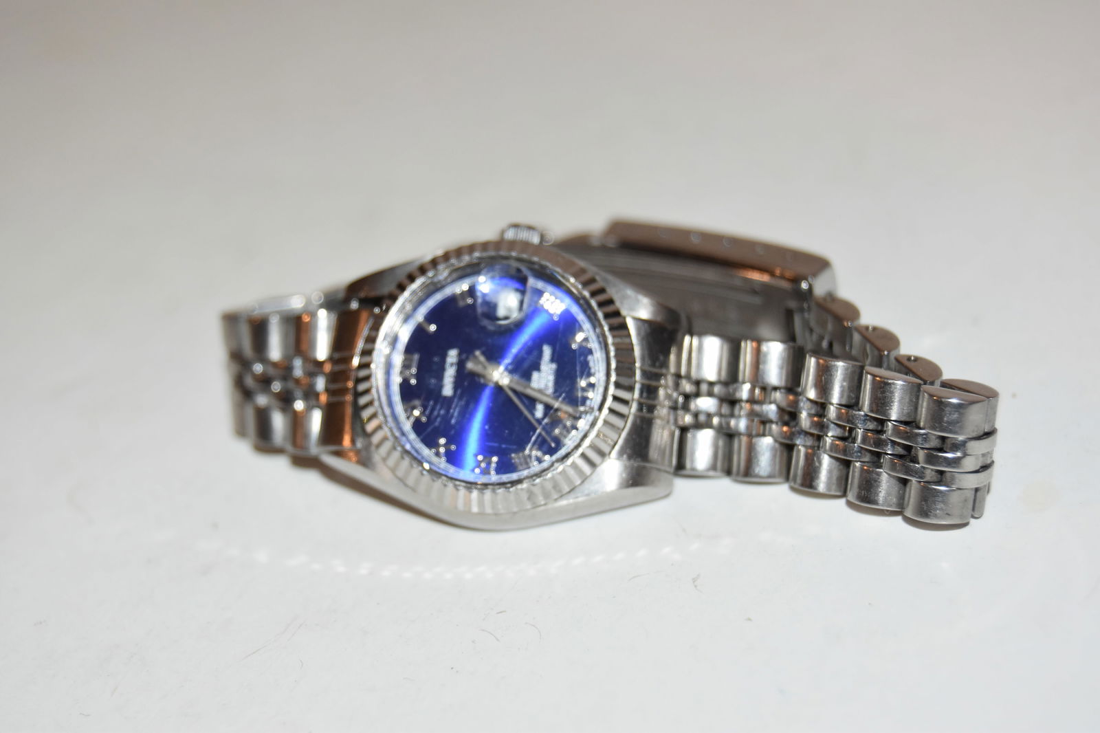 vintage invicta watch blue dial woman works great!!! Face has some scratches: vintage invicta watch blue dial woman works great!!! Face has some scratches Please view all photos as they are part of the description and condition of this Item, Feel free to contact me with questio