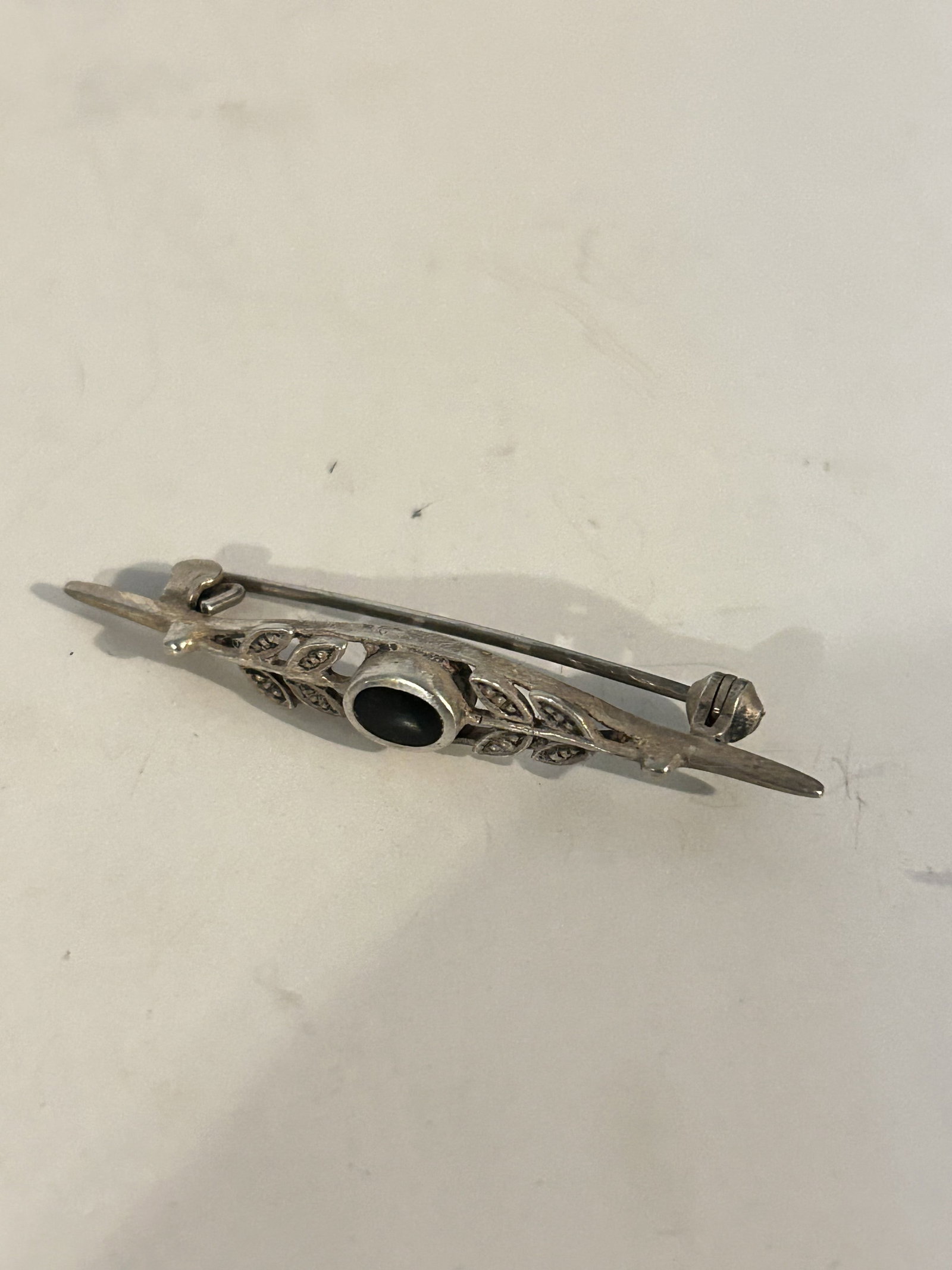 Vintage Sterling Silver onyx marcasite brooch: Vintage Sterling Silver onyx marcasite brooch Please view all photos as they are part of the description and condition of this Item, Feel free to contact me with questions or picture requests! Used It