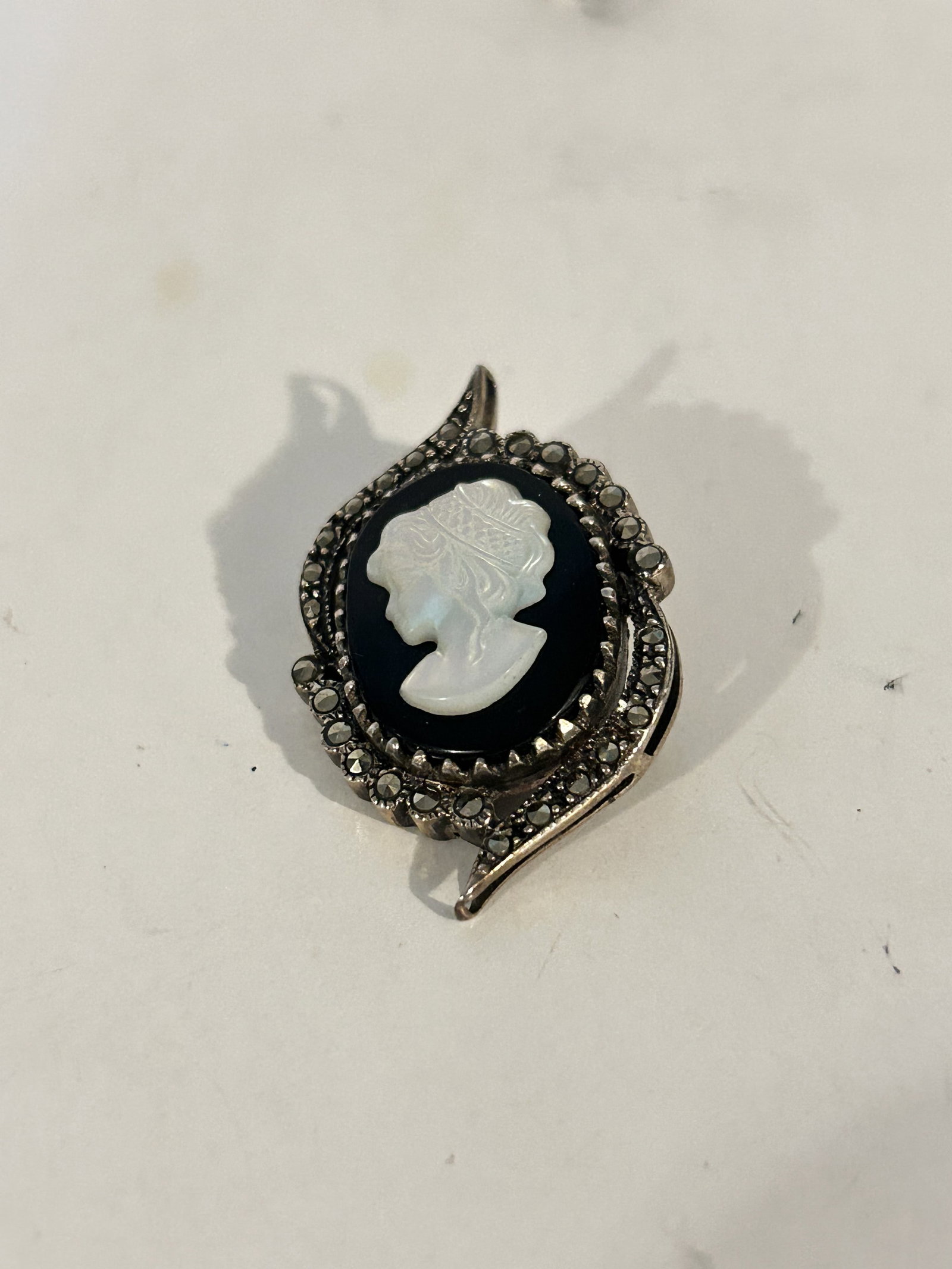 Vintage Sterling Silver cameo mother of pearl marcasite pendant: Vintage Sterling Silver cameo mother of pearl marcasite pendant Please view all photos as they are part of the description and condition of this Item, Feel free to contact me with questions or picture