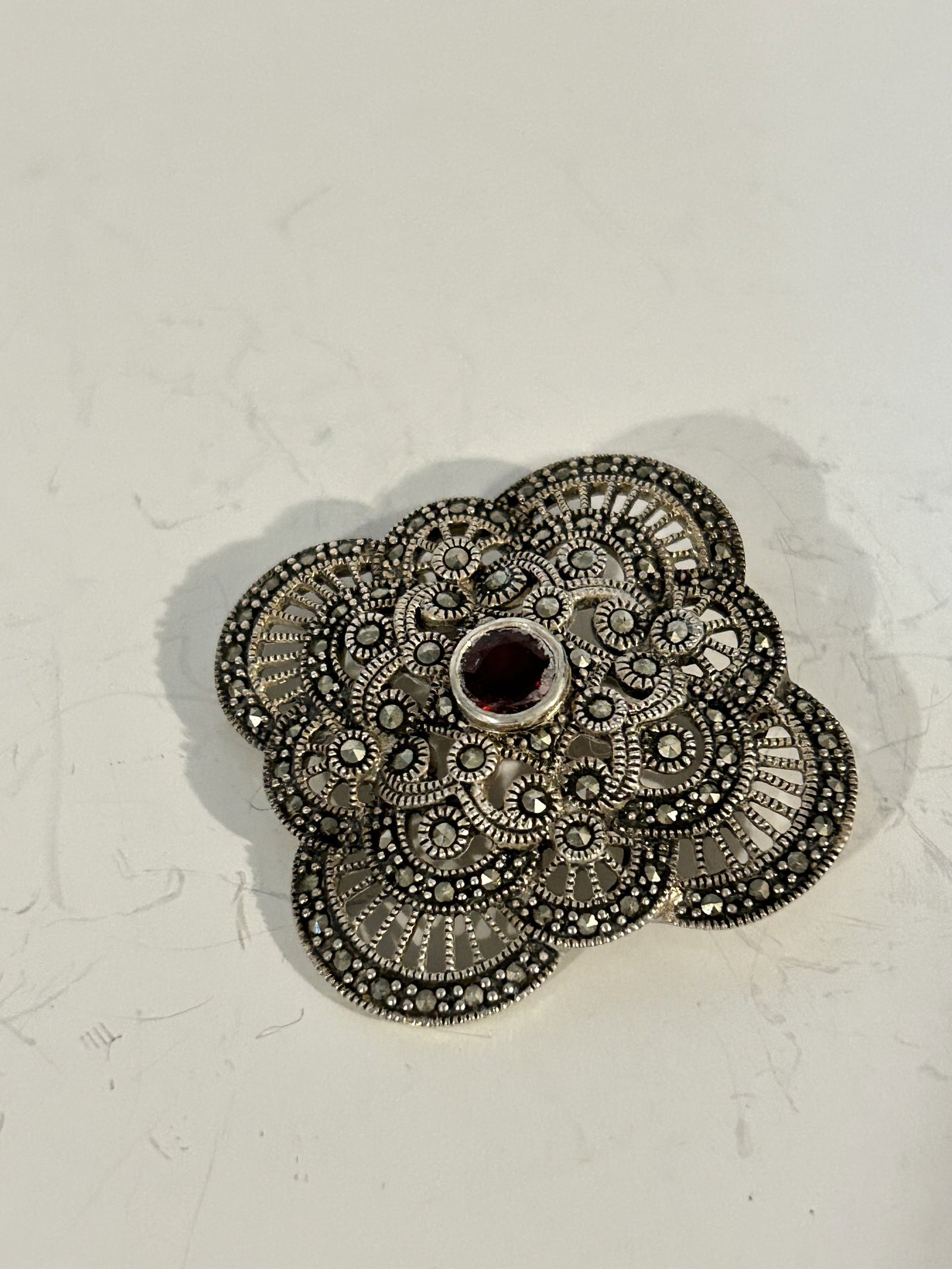 Vintage Sterling Silver marcasite amethyst floral Brooch: Vintage Sterling Silver marcasite amethyst floral Brooch Please view all photos as they are part of the description and condition of this Item, Feel free to contact me with questions or picture reques