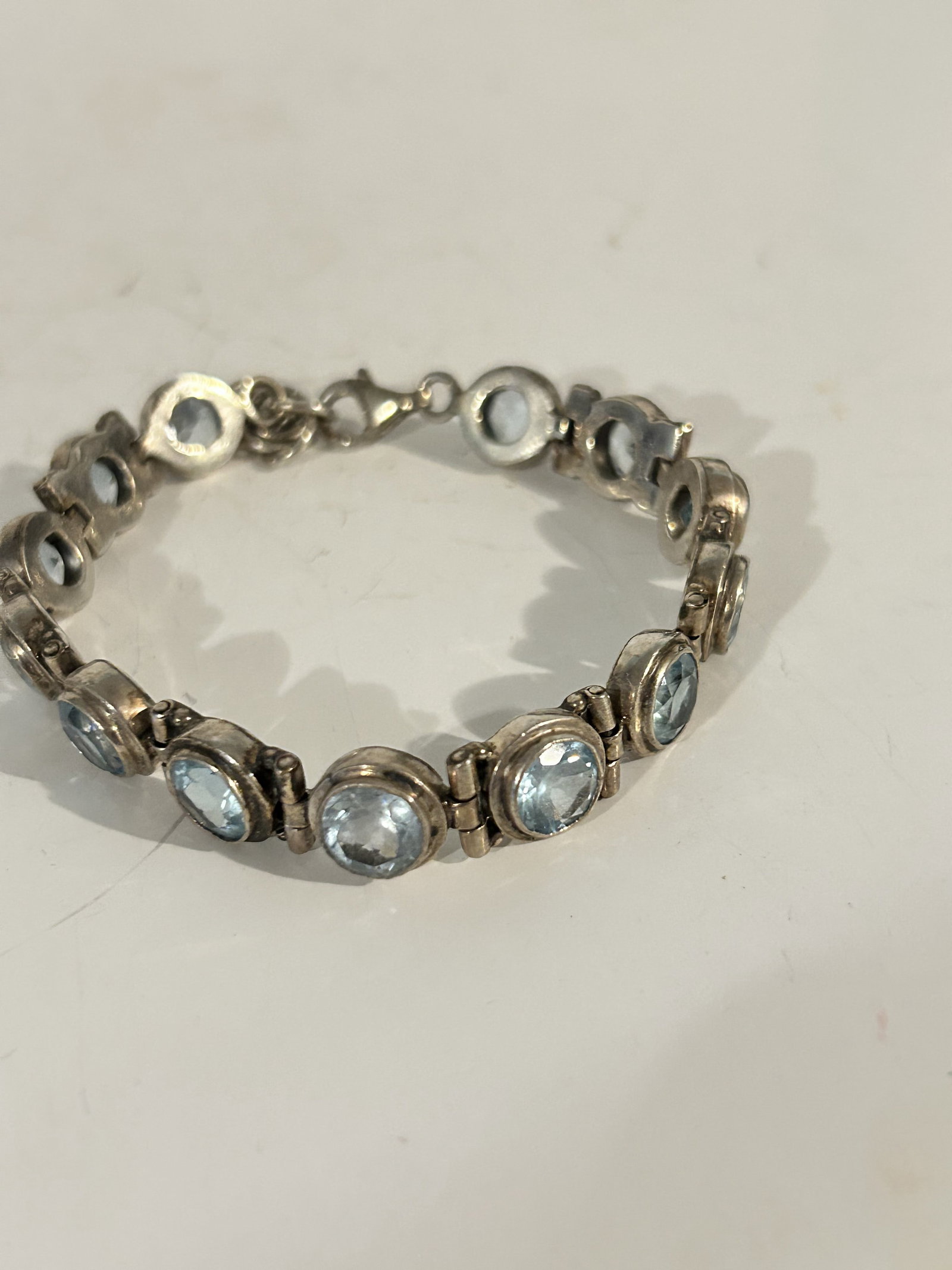 Vintage 925 Sterling Silver Genuine Blue Topaz Faceted Ladies Tennis Bracelet 8": Vintage 925 Sterling Silver Genuine Blue Topaz Faceted Ladies Tennis Bracelet 8" Please view all photos as they are part of the description and condition of this Item, Feel free to contact me with que