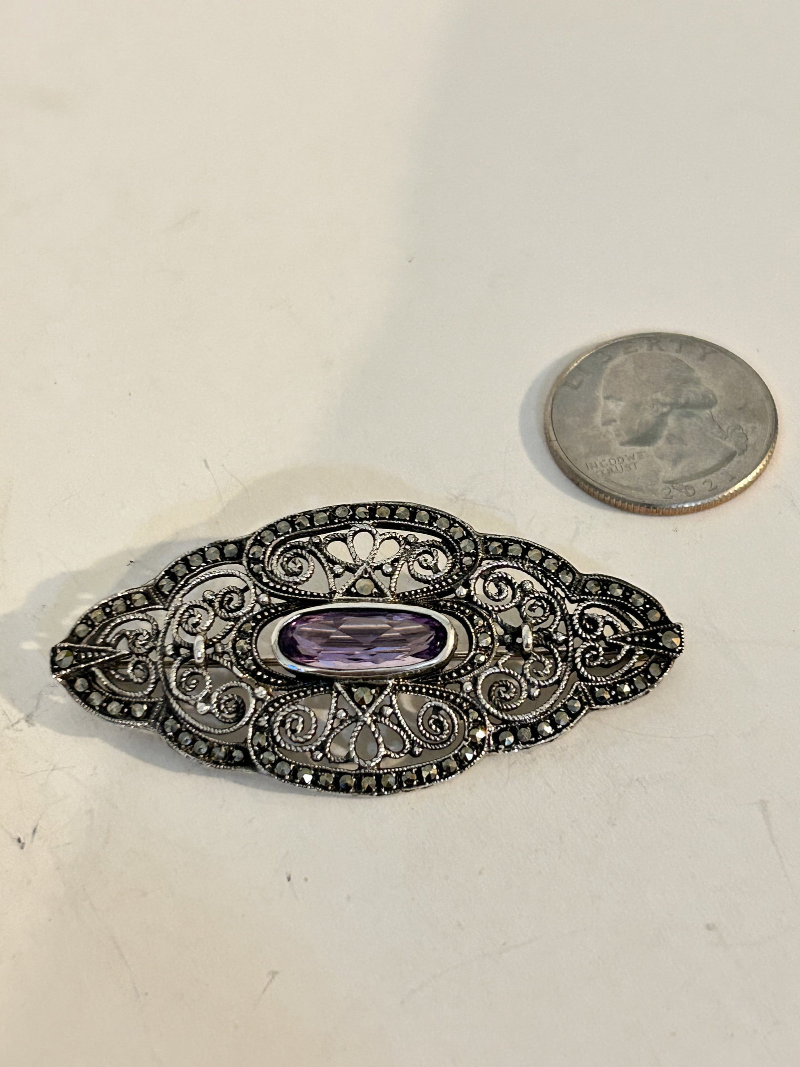 Vintage Sterling Silver marcasite Amethyst brooch: Vintage Sterling Silver marcasite Amethyst broochPlease view all photos as they are part of the description and condition of this Item, Feel free to contact me with questions or picture requests! Used