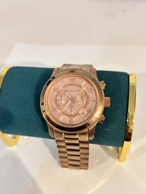 Michael Kors MK8096 50mm Rose Gold Stainless Steel Case Rose Gold Stainless works great! Needs bat