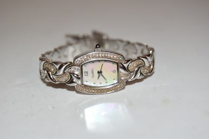 Elgin Women's Crystal Silver Watch Rectangle Pearl Dial on Crystal Linked Band works great!!!