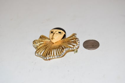 Vintage gold tone enamel rhinestone lady Brooch missing a couple stones