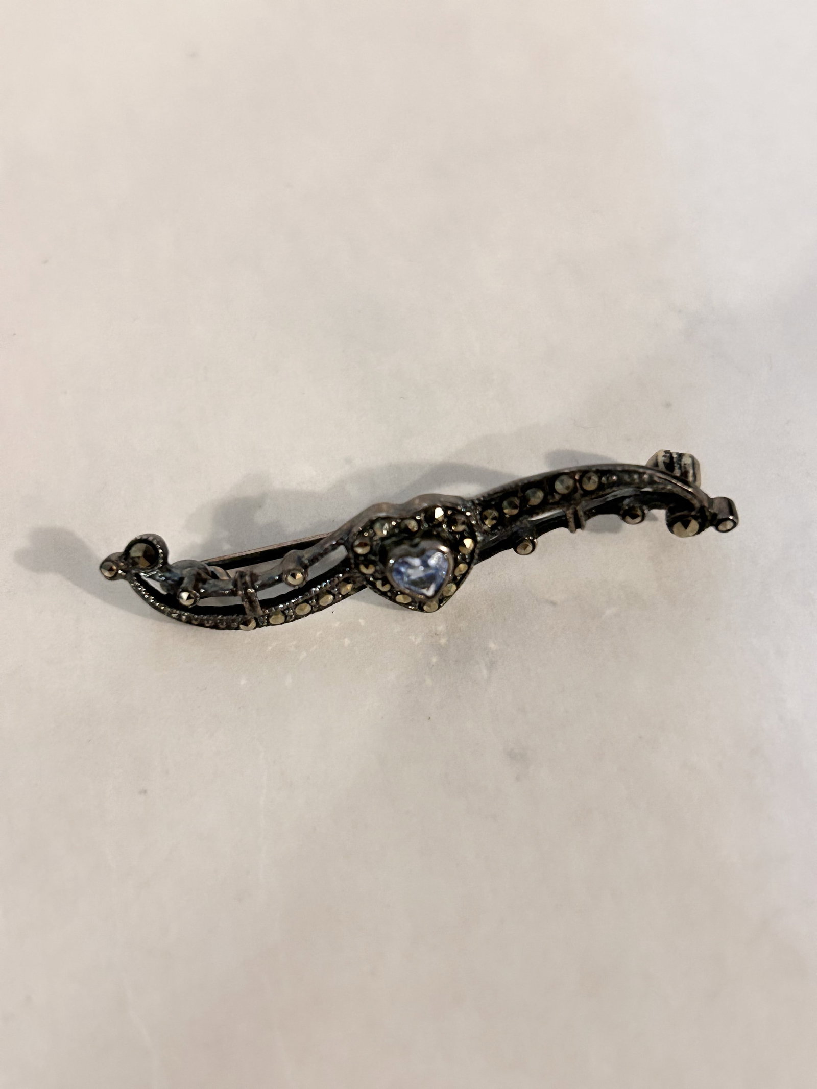 Vintage Sterling Silver sapphire marcasite Brooch: Vintage Sterling Silver sapphire marcasite Brooch Please view all photos as they are part of the description and condition of this Item, Feel free to contact me with questions or picture requests! Use